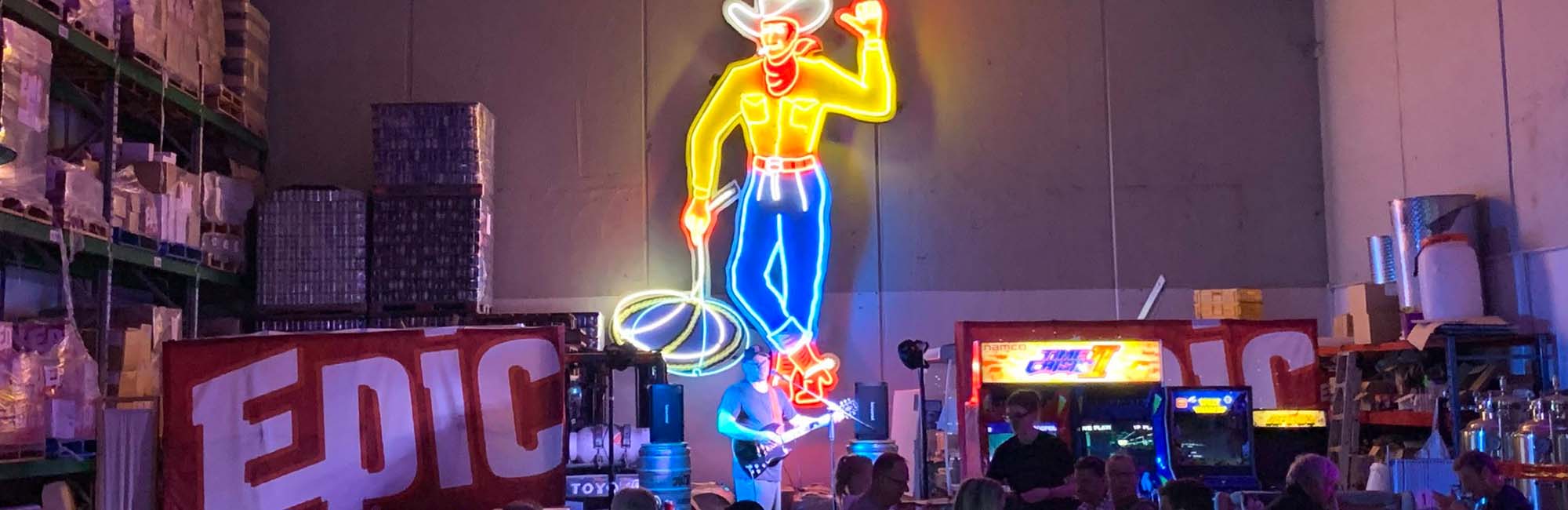 The epic band playing in the Epic Taproom with Big Tex the neon cowboy overlooking. 